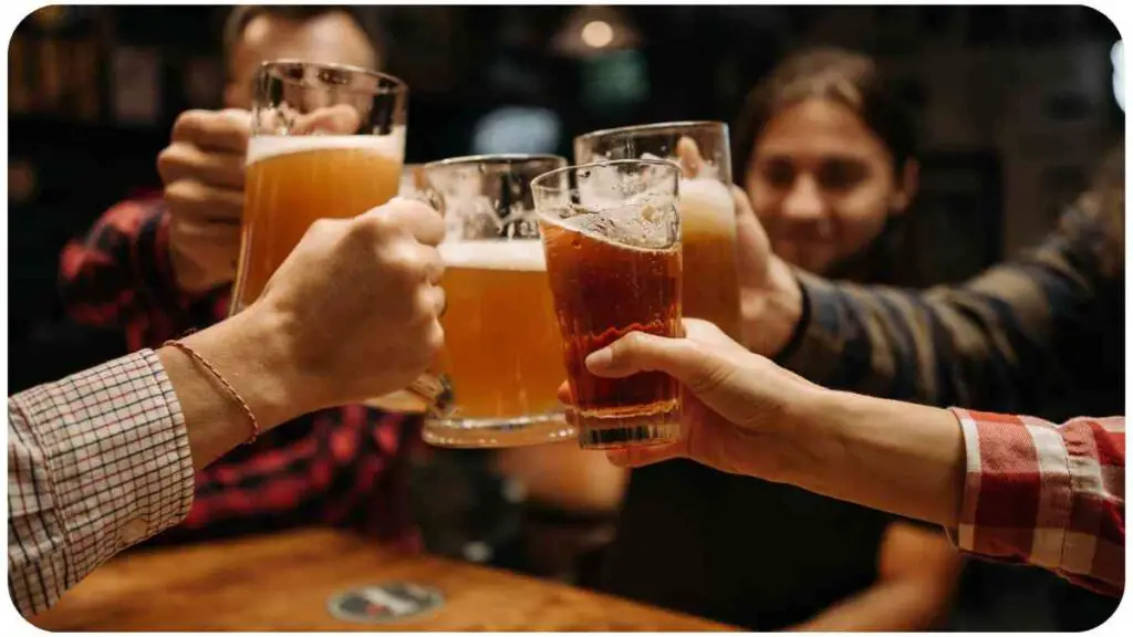a group of people toasting with beer glasses