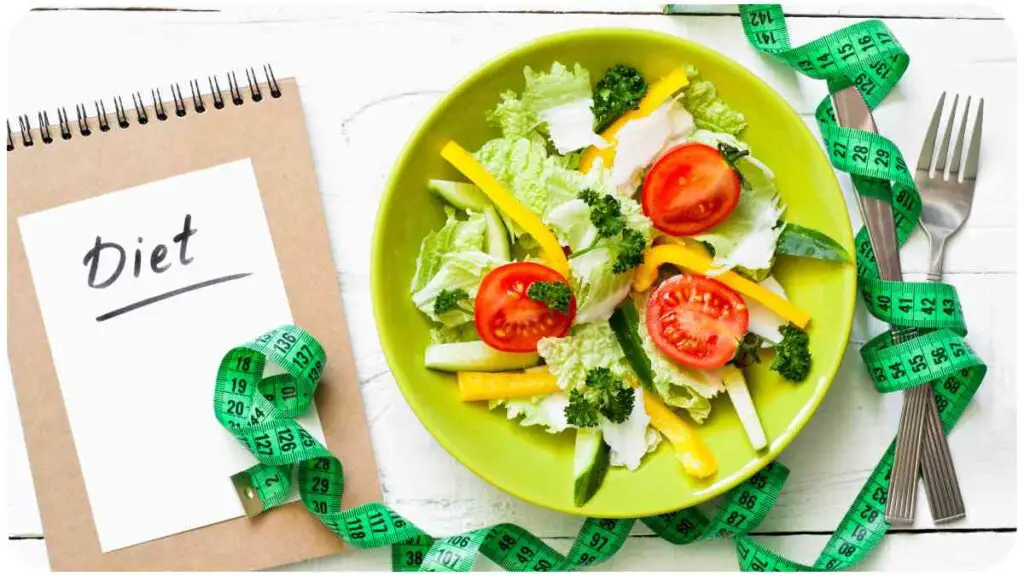 diet food on a white wooden table with a notebook and green tape on it, top view, copy space banco de imagens